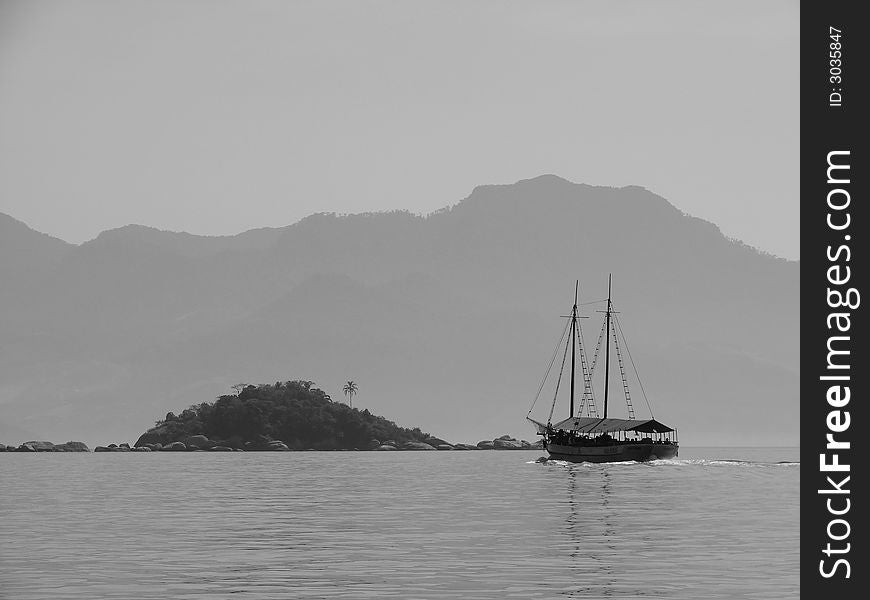 Boat nearby a small island. Boat nearby a small island