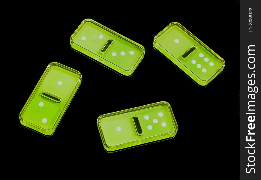 Domino green pieces in a black background