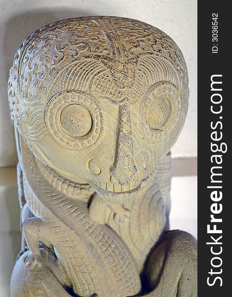 A stone sculpture of a mythical asian creature. A stone sculpture of a mythical asian creature