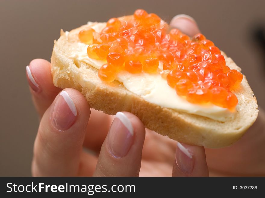 Fresh and tasty sandwich with red caviar