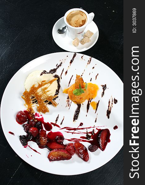 Ice cream dessert with fruits and coffee. Ice cream dessert with fruits and coffee