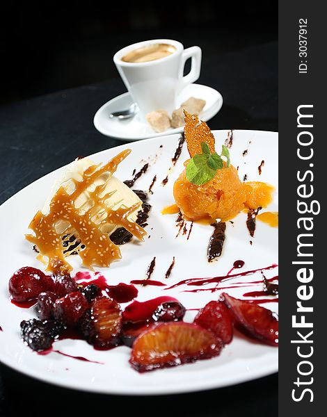Ice cream dessert with fruits and coffee. Ice cream dessert with fruits and coffee