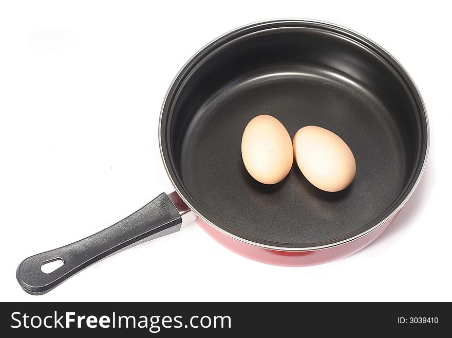 Two brown eggs in a frying pan. Two brown eggs in a frying pan