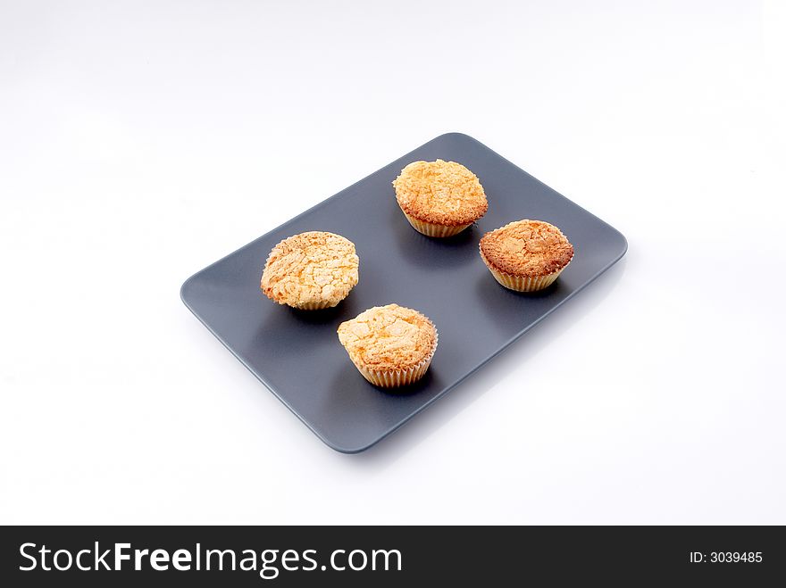 An isolated on white fairy cakes plate