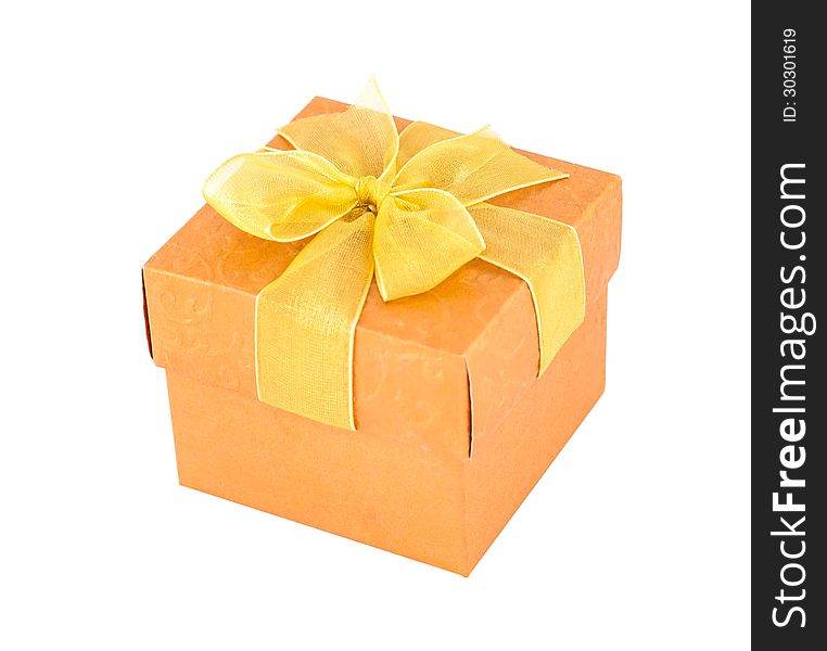 Orange gift box with yellow ribbon isolated om white background