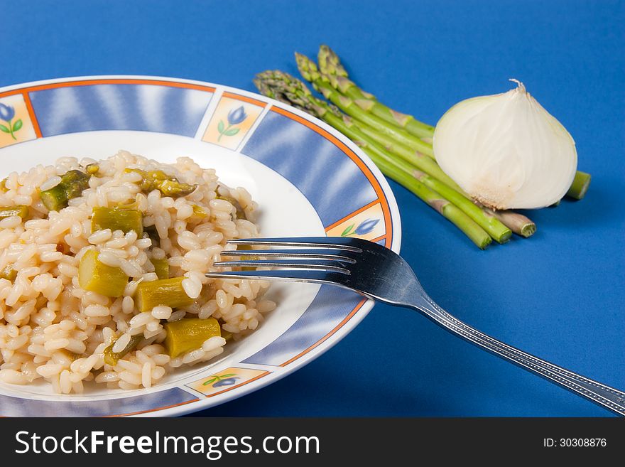 Rice with asparagus and onion dish of Italian cuisine