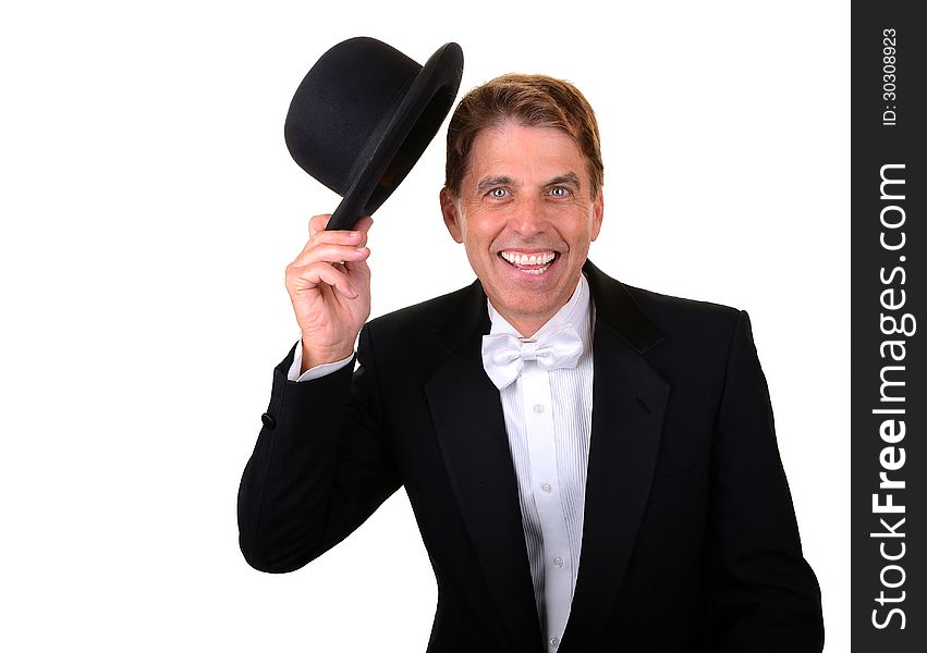 Happy man with green eyes wearing a tuxedo holding a hat isolated on white. Happy man with green eyes wearing a tuxedo holding a hat isolated on white.