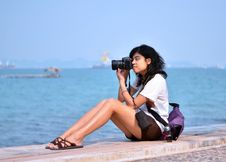 Young Female Photographer Taking Pictures On Beach Stock Photos Young Female Photographer Taking Pictures On Beach Stock Photos
