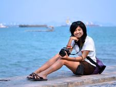 Young Woman Taking Pictures On The Beach Stock Images Young Woman Taking Pictures On The Beach Stock Images