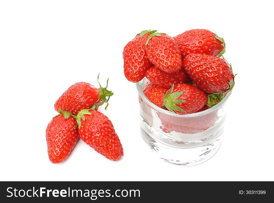 Jar filled with beautiful strawberries on white background