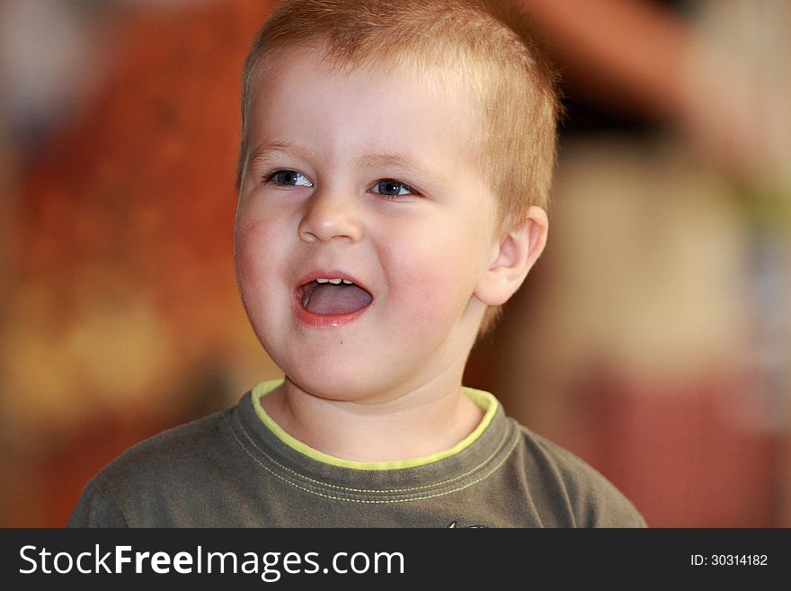 Little boy laughs heartily at zoo