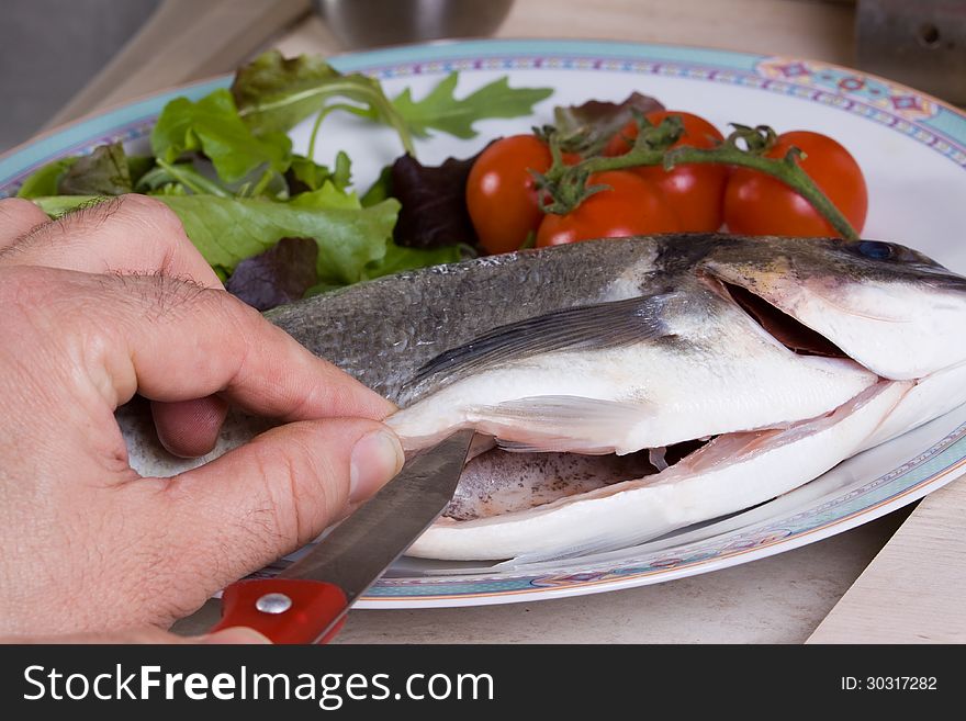 Preparation of sea bream one of the most common fish at table