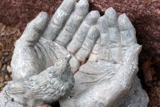 Stone Hands Open And Holding Little Bird In Palm Stock Images Stone Hands Open And Holding Little Bird In Palm Stock Images