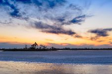 The Oil Pumping Machine On Ice Lake Stock Photos The Oil Pumping Machine On Ice Lake Stock Photos
