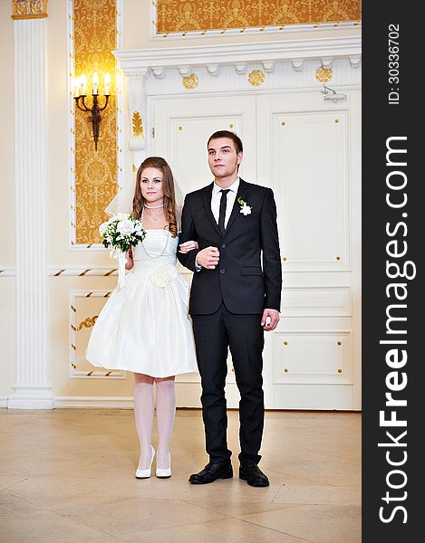 Bride and groom at wedding ceremony in registration hall