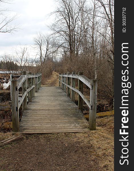 Old wood bridge over marsh water