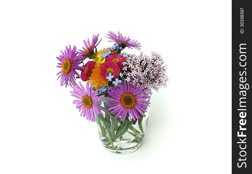 Flowers in a glass on white background