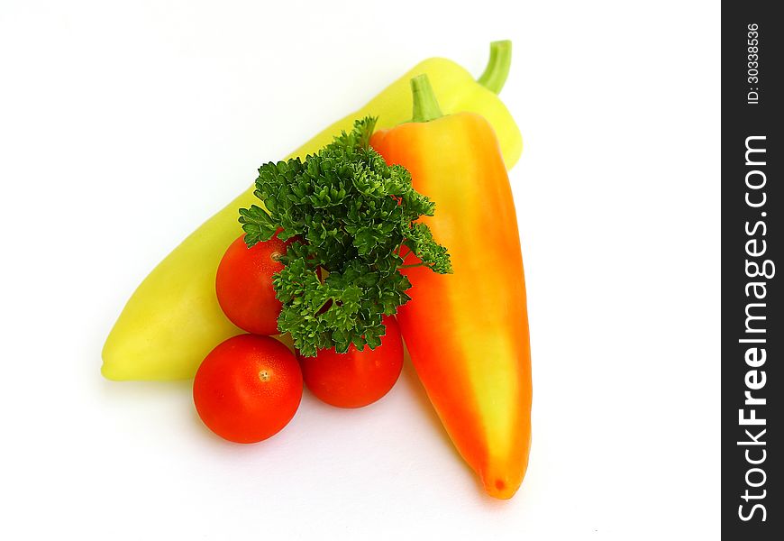 Peppers, tomatoes and parsley on white background