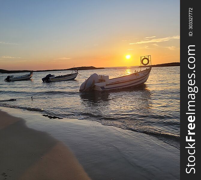 Fishing Boats On The Background Of The Sunset