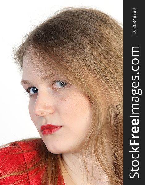 Close up studio portrait of beautiful young woman in red