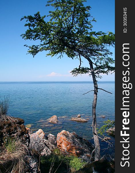 Rocky shore of the the Lake Baikal in the summer sun light