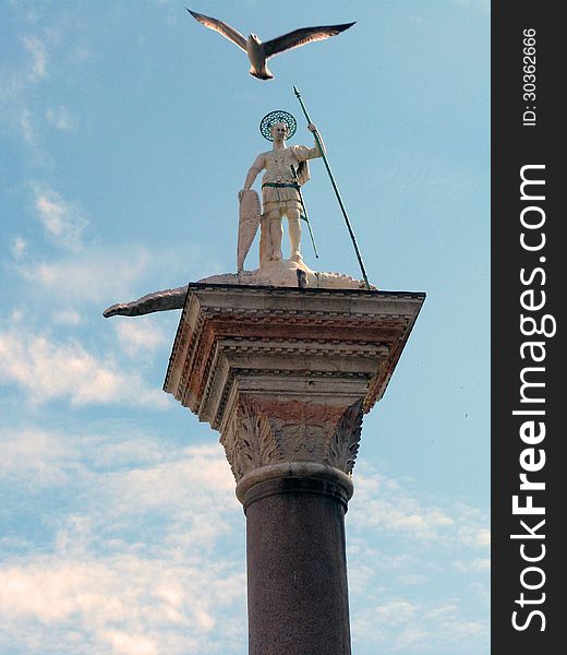 Venice - Column of St. Teodoro of Amasea at Piazzetta (little piazza) San Marco with a flying gull above the sculpture