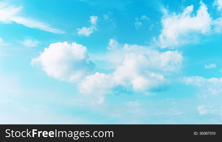 Real blue sky and beautiful clouds. Real scene without any light effects. Real blue sky and beautiful clouds. Real scene without any light effects.