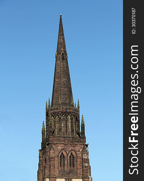 The Spire of a Country Church Against a Blue Sky. The Spire of a Country Church Against a Blue Sky.