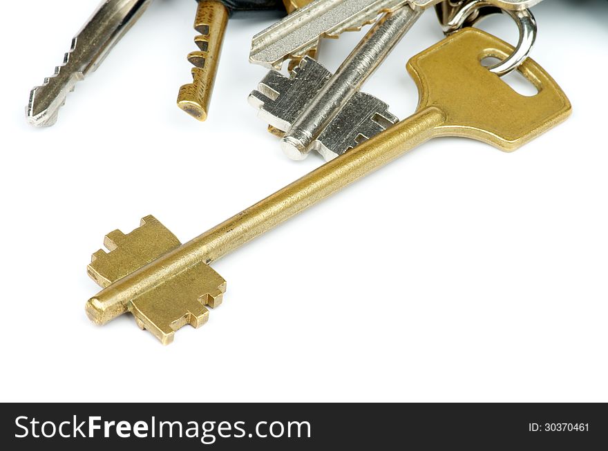 Heap of Various House Keys isolated on white background