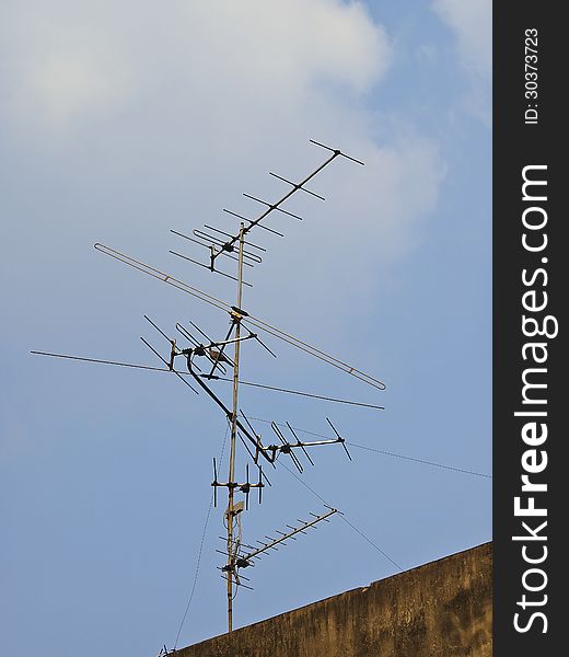 Old antenna on top roof in sunlight