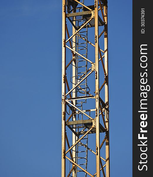 Part of column tower crane in sunny day. Part of column tower crane in sunny day