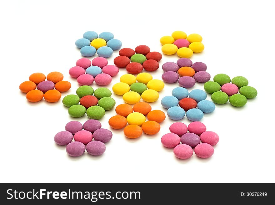 Colored chocolate candy on a white background. Colored chocolate candy on a white background