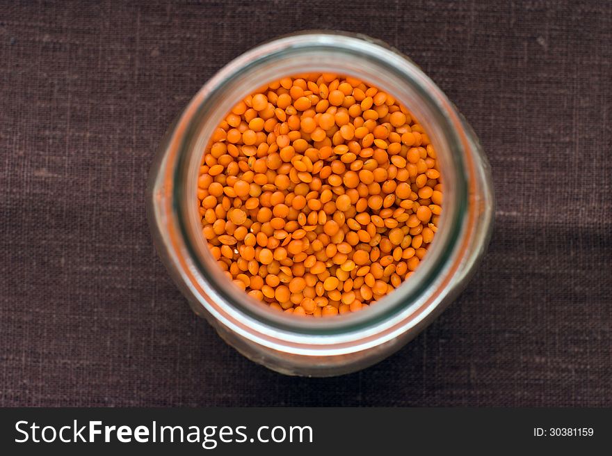Red lentils in a jar from upper view