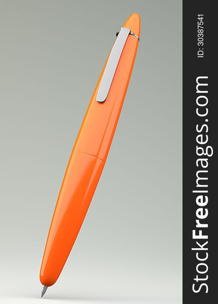 Orange ballpoint pen on grey background
