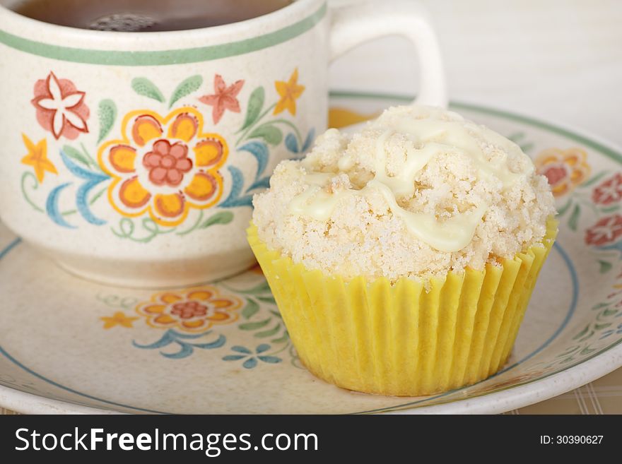 Lemon muffin and cup of coffee on a plate. Lemon muffin and cup of coffee on a plate