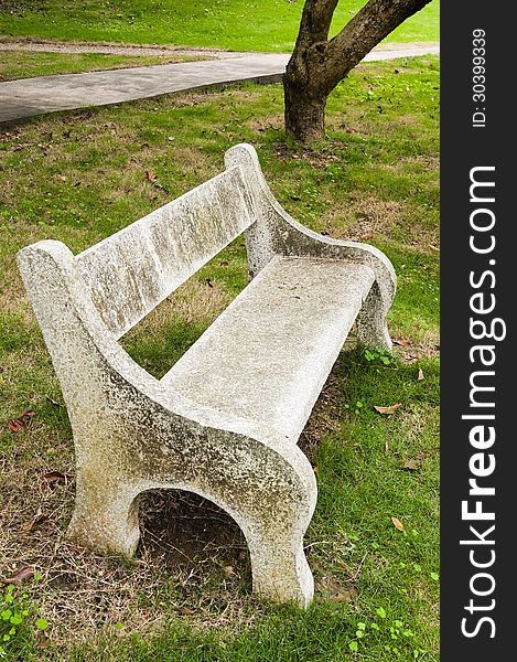 Stone   chair  in  the   garden. Stone   chair  in  the   garden