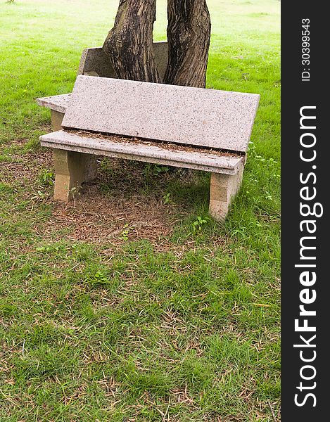 Stone   chair  in  the   garden. Stone   chair  in  the   garden