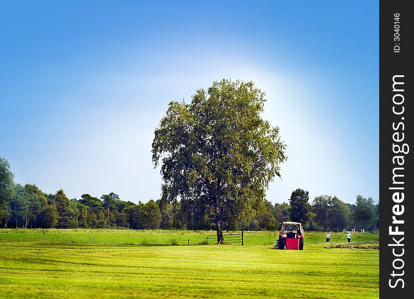 Landscape with blue sky and tractor. Landscape with blue sky and tractor