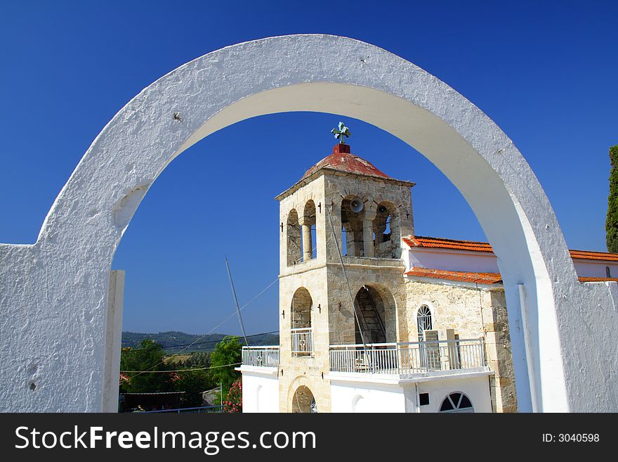 Arch with a church in the background