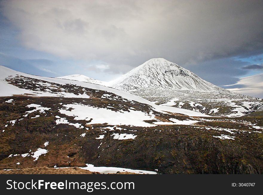 Icelandic landscape with snowy mountain