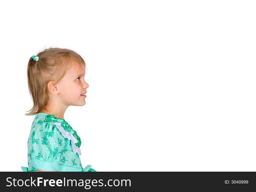 The dreaming girl looks upwards on an isolated background