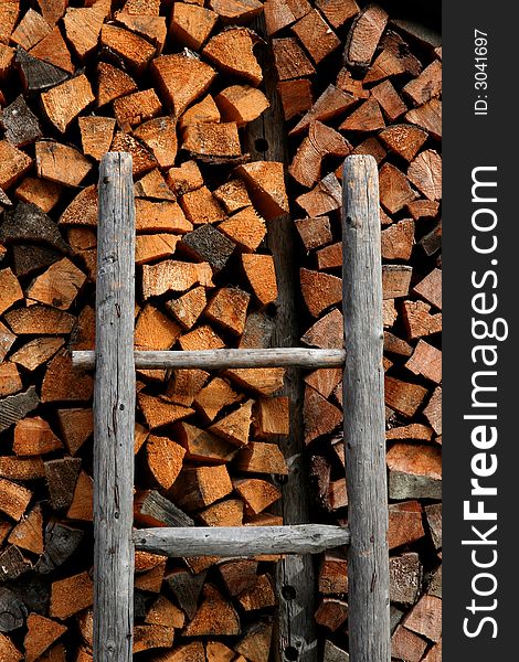 Image of a Firewood stack and ladder in Austrian Tirol. Image of a Firewood stack and ladder in Austrian Tirol