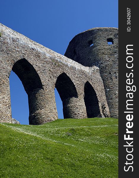 Curtain walls and tower as parts of gothic castle ruin. Curtain walls and tower as parts of gothic castle ruin