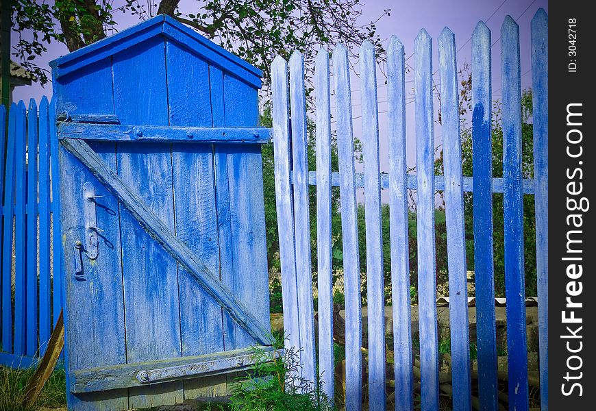 Old blue gate and fence