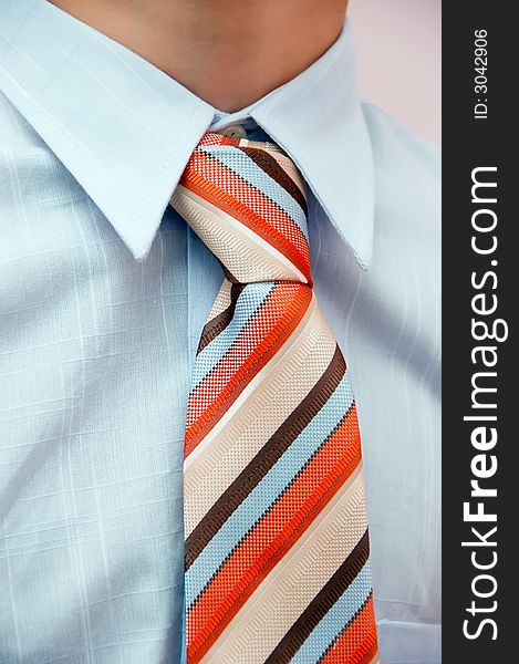 Detail of a business man with coloured tie. Detail of a business man with coloured tie