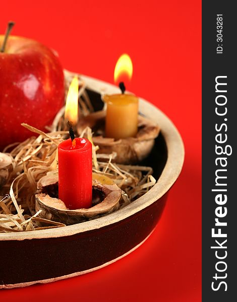 Christmas candlestick on the red background