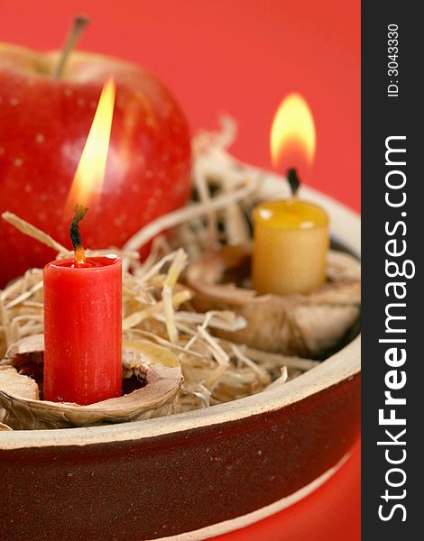 Christmas candlestick on the red background