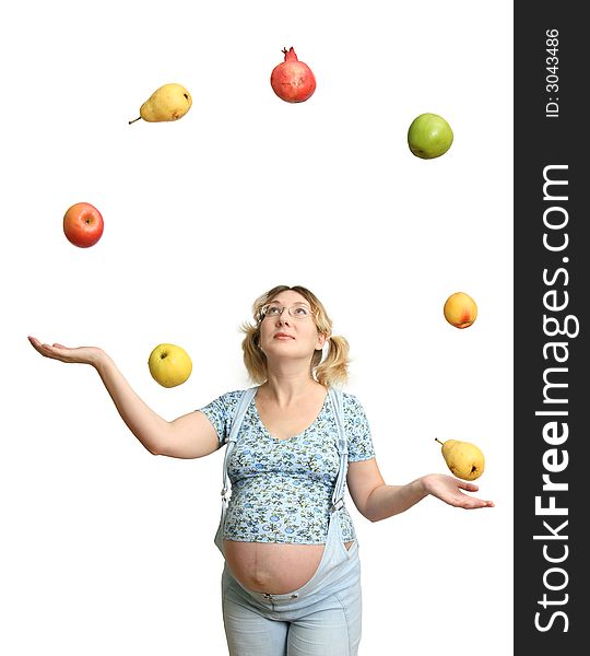 The Expectant mother tosses and caughts the fruits on white background. The Expectant mother tosses and caughts the fruits on white background.
