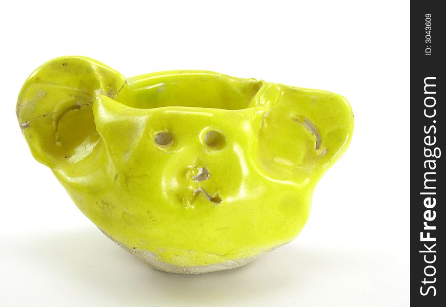 This one is a child's hand made clay sculpture. Glazed and cured in bright yellow. It was also meant to be a coin holder with a tiny face on the front. This one is a child's hand made clay sculpture. Glazed and cured in bright yellow. It was also meant to be a coin holder with a tiny face on the front.