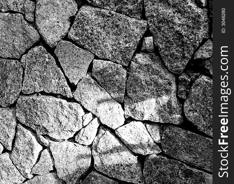 granite cut in different shapes stack to create a strong wall, people may have divided background but can have strong bonds. granite cut in different shapes stack to create a strong wall, people may have divided background but can have strong bonds